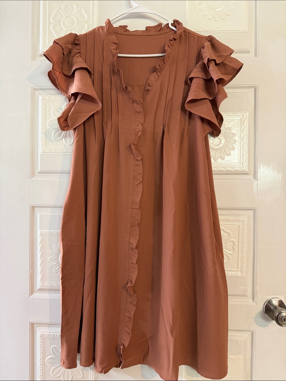 NWOT Cute little flowy dress with ruffles size xl. Never worn.